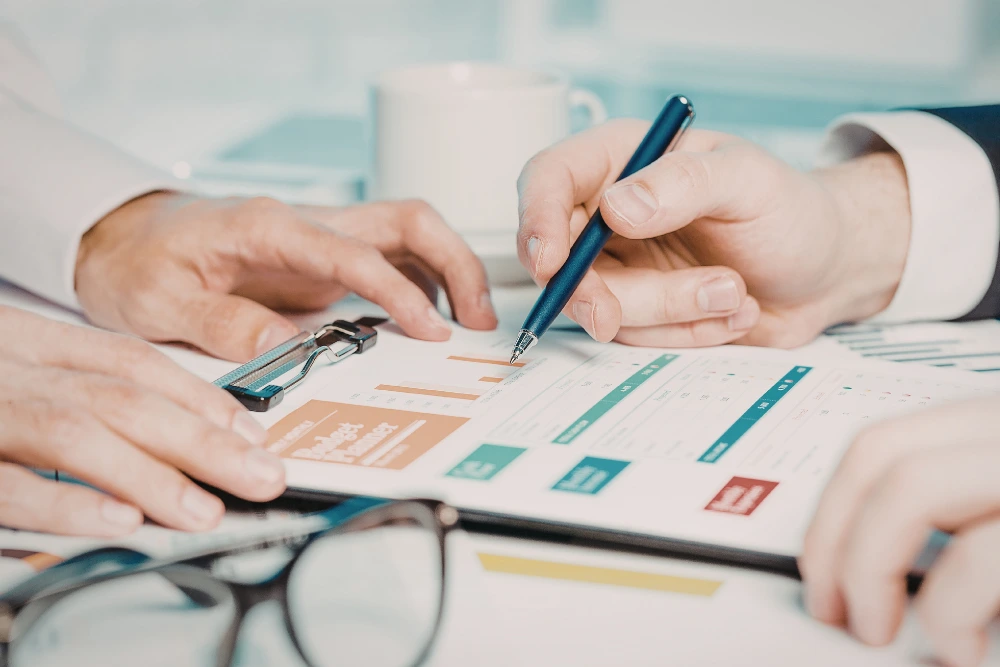 Two people reviewing a project plan